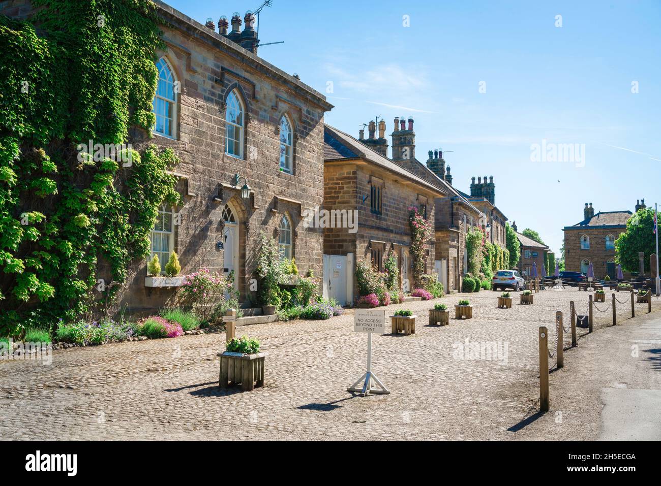 Ripley North Yorkshire ,view of attractive gritstone residential properties in Hollybank Lane in the centre of the scenic Yorkshire village of Ripley Stock Photo