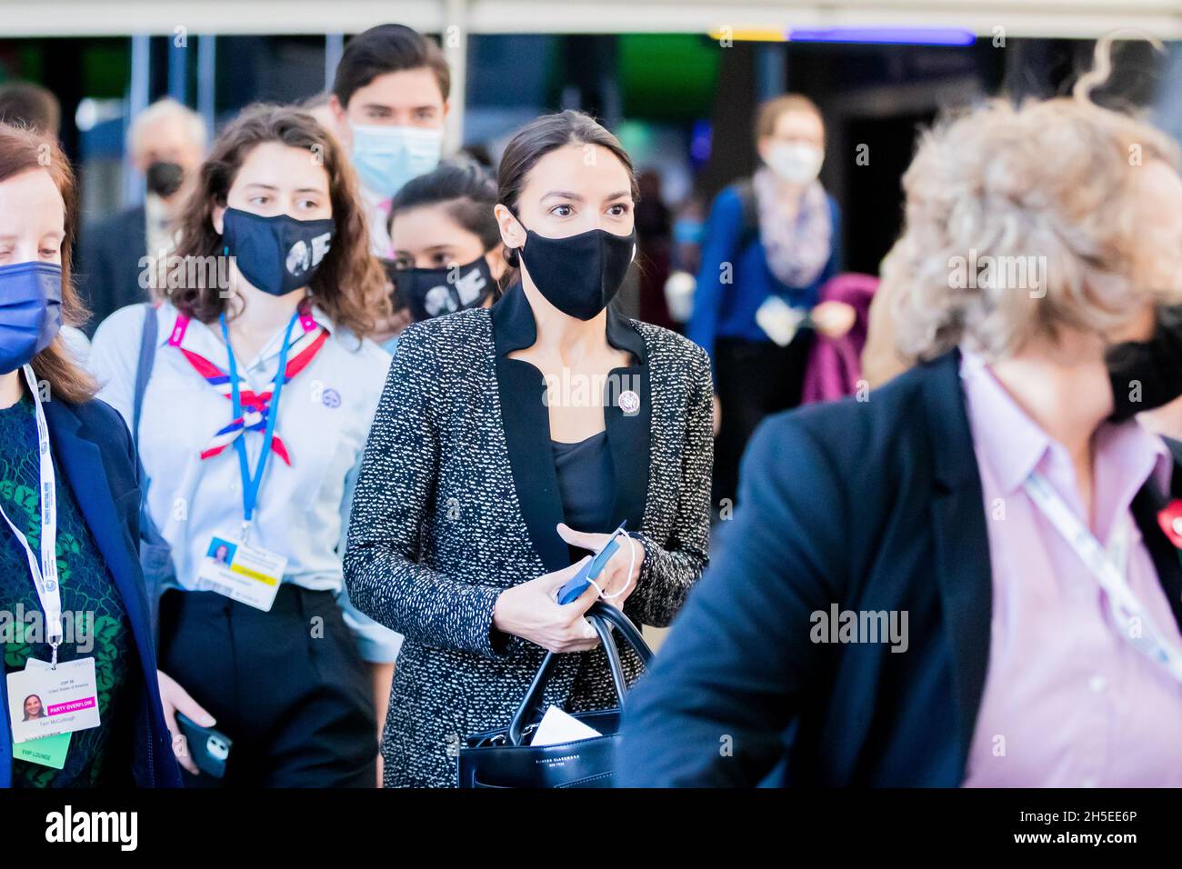 Glasgow, UK. 09th Nov, 2021. Alexandria Ocasio-Cortez (M), Democratic US Congresswoman and Representative for New York State, arrives at the UN Climate Change Conference COP26 in Glasgow. For two weeks in Glasgow, some 200 countries are wrestling with how to still achieve the goal of limiting global warming to 1.5 degrees compared to pre-industrial times, if possible. Credit: Christoph Soeder/dpa/Alamy Live News Stock Photo