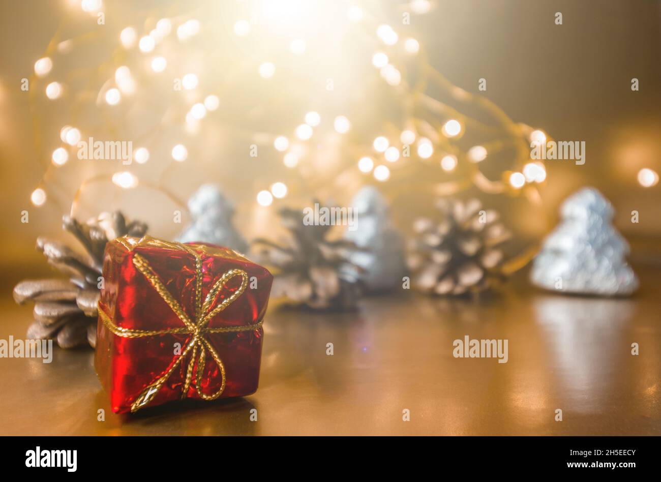 Gift in red wrapping paper. New Guidance background. Stock Photo