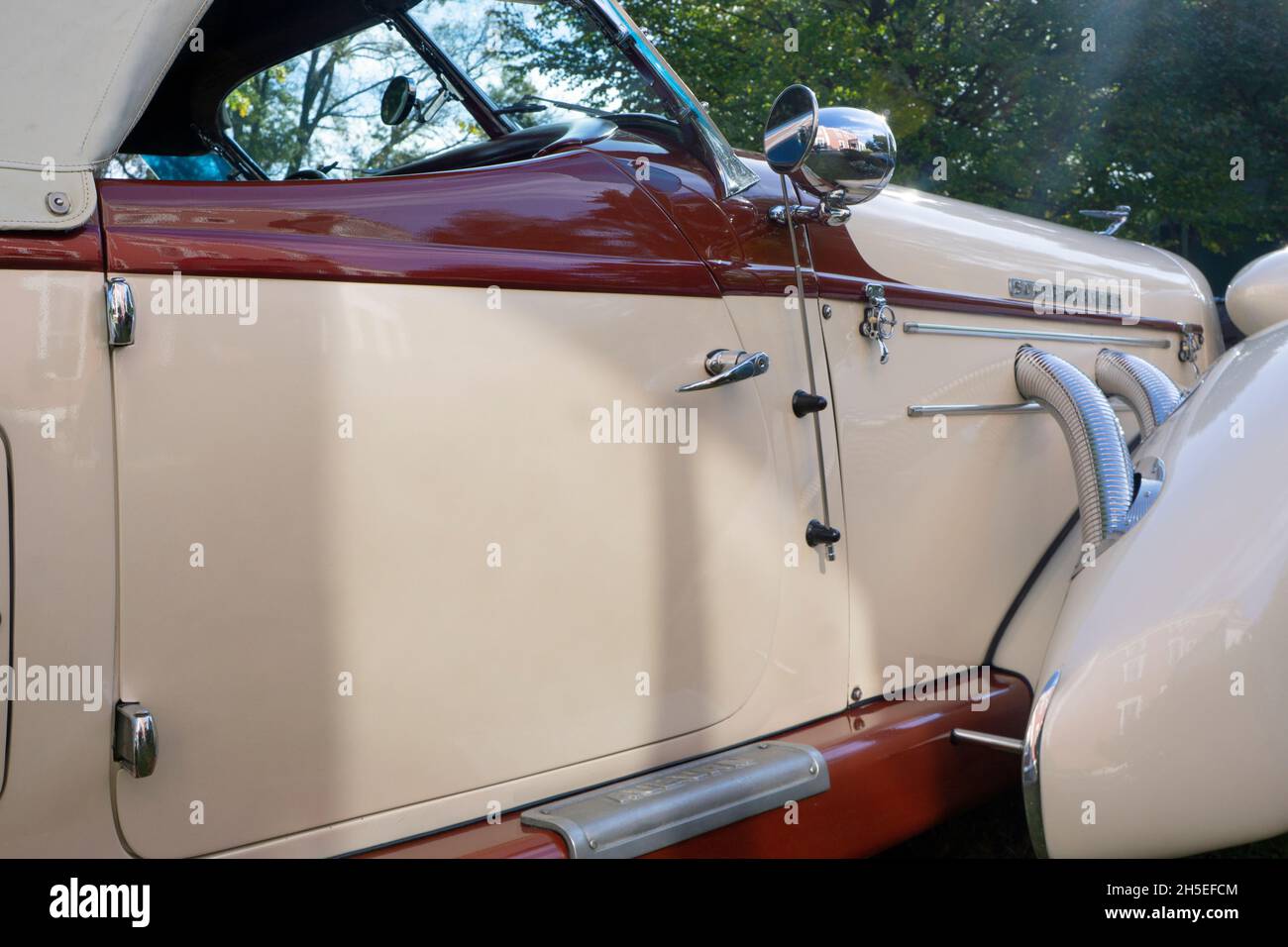 Side view details of a vintage 1936 Auburn Boattail Speedster convertible parked in Queens at a vintage car show. Stock Photo
