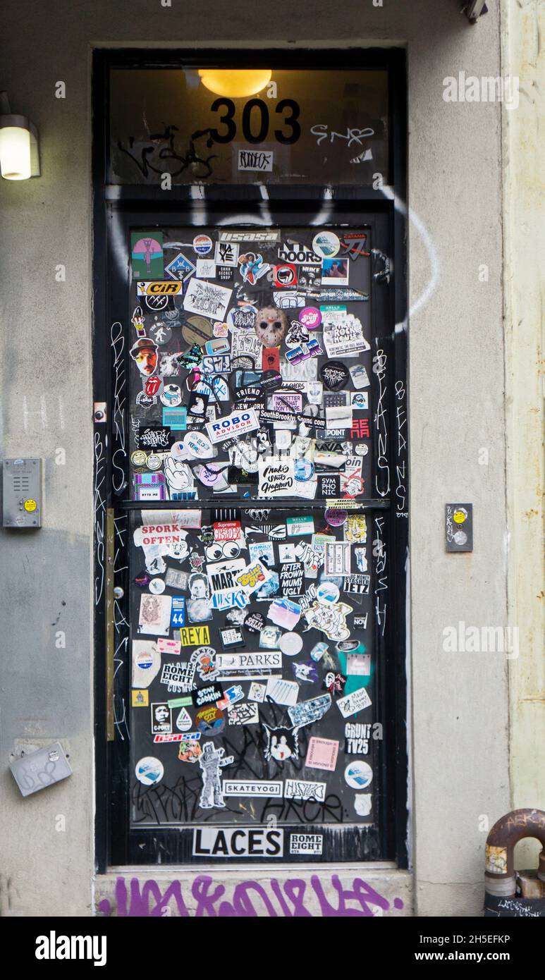A doorway on Grand Street in Williamsburg, Brooklyn with several