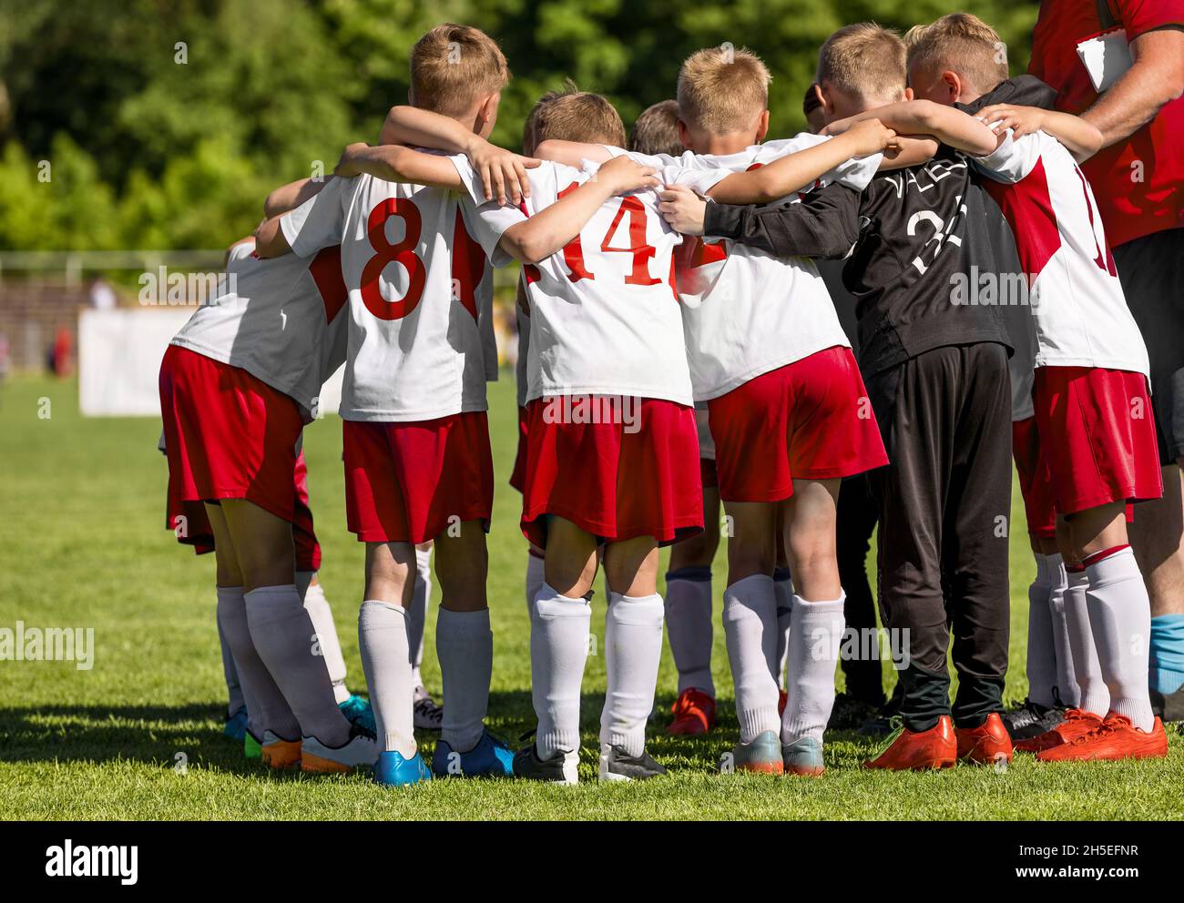 Children Team Sport. Kids Play Sports. Children Sports Team United Ready to Play Game. Football Coach With School Boys. Youth Sports For Children. Boy Stock Photo