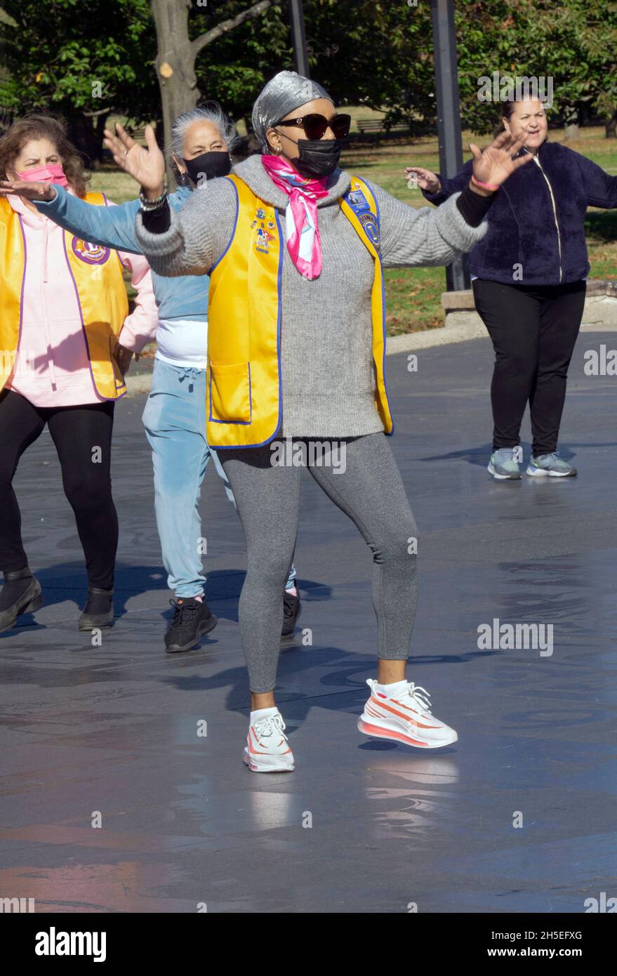 A group of middle aged women from the Lions club do dance exercises in Flushing Meadows Corona Park in Queens, New York. Stock Photo