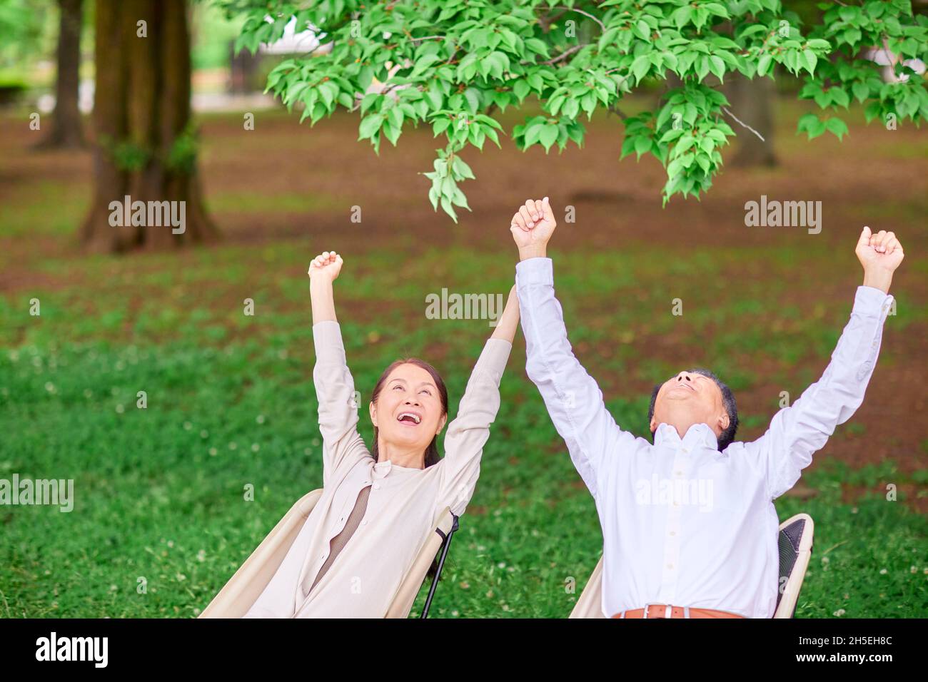 Japanese senior couple at a city park Stock Photo - Alamy