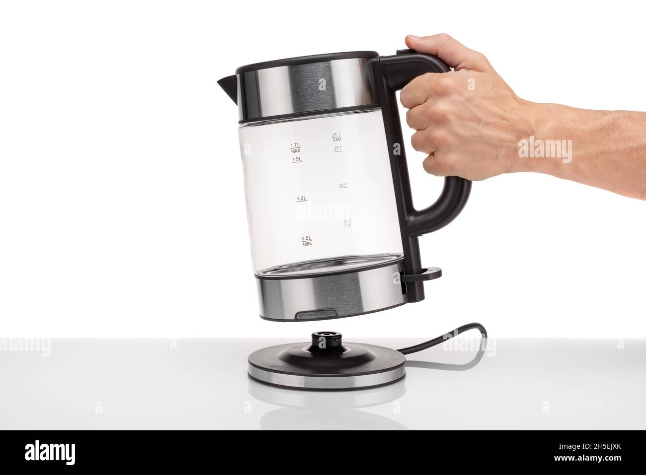 https://c8.alamy.com/comp/2H5EJXK/a-hand-holds-a-glass-electric-modern-transparent-kettle-on-a-white-background-close-up-2H5EJXK.jpg