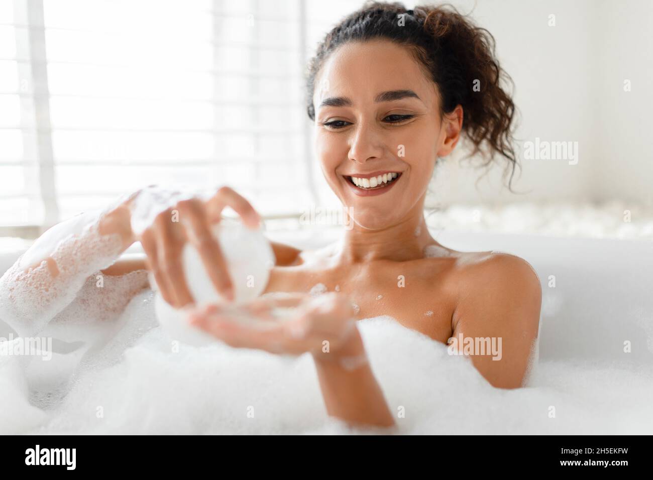 Woman taking bath hi-res stock photography and images - Alamy