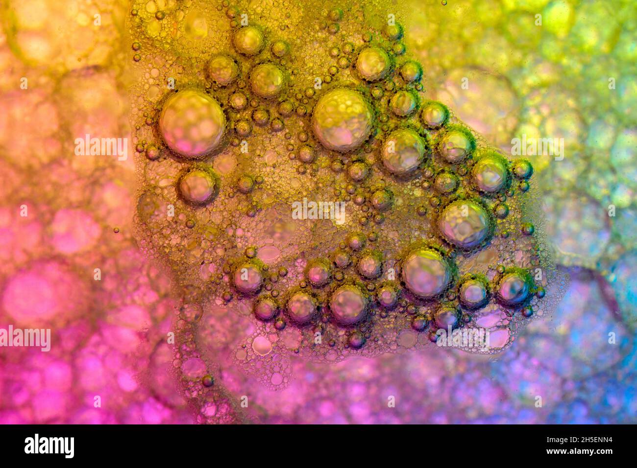 Oil and soap bubbles in water Stock Photo