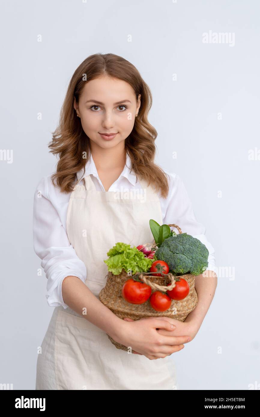 Cute girl with a basket of fresh vegetables Stock Photo - Alamy