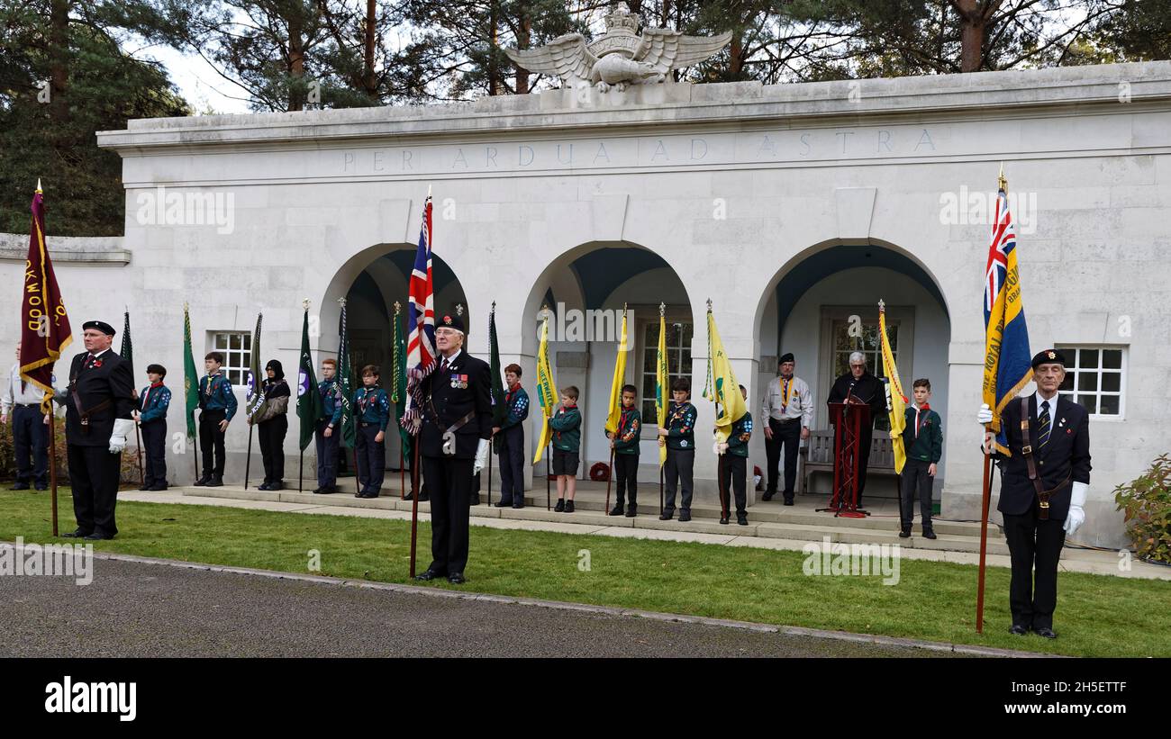 Sunday 7th November 2021. Scout & guide standard bearers form up with those of the Last Post Association & Royal British Legion for a religious service & invocation.  Brookwood Last Post Association hold their monthly service with hundreds of scouts, guides & the 1st Claygate Scout & Guide Band. Air Forces Shelter, Brookwood Military Cemetery, Surrey. Stock Photo