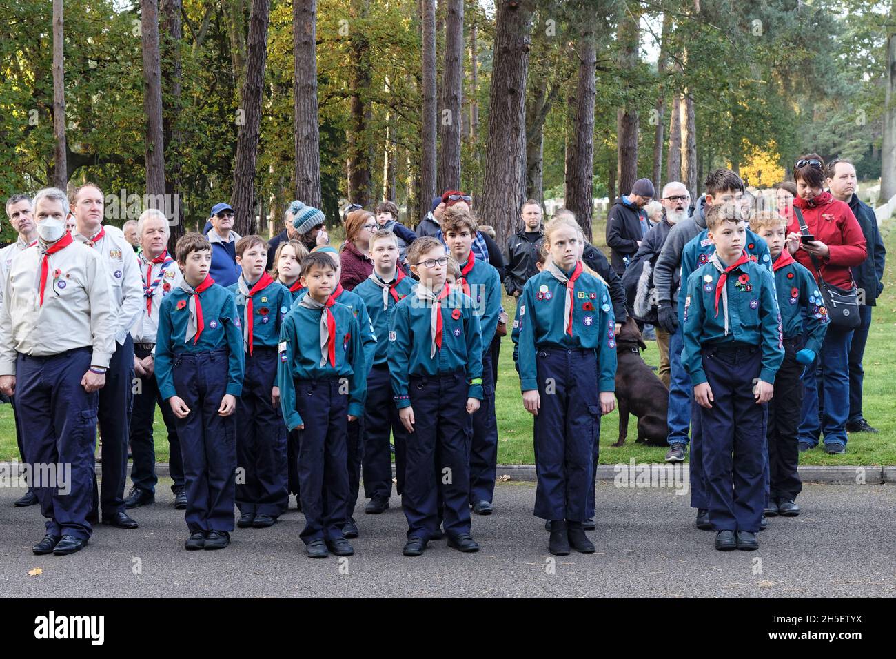 Sunday 7th November 2021. Scouts and guides form up for the remembrance service. Brookwood Last Post Association hold their monthly service with hundreds of scouts, guides & the 1st Claygate Scout & Guide Band. Air Forces Shelter, Brookwood Military Cemetery, Surrey. Stock Photo