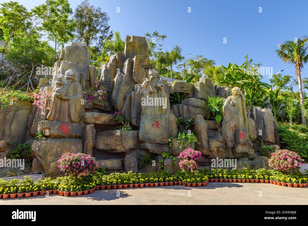 Hainan, China - 18 December 2017: Rock formations depicting prosperity, health and wealth. Stock Photo