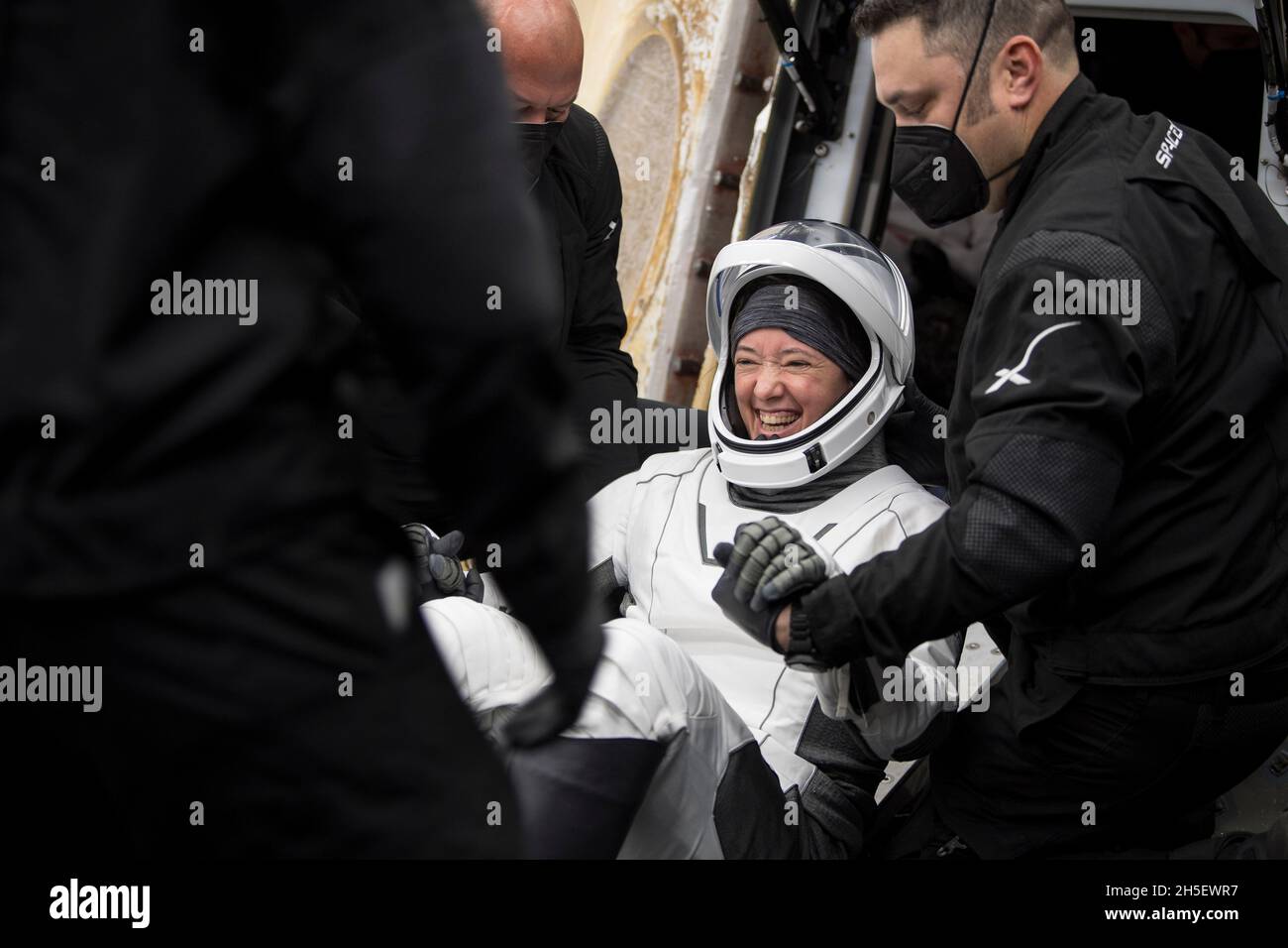 NASA astronaut Megan McArthur is helped out of the SpaceX Crew Dragon Endeavour spacecraft onboard the SpaceX GO Navigator recovery ship after she and NASA astronaut Shane Kimbrough, Japan Aerospace Exploration Agency (JAXA) astronaut Aki Hoshide, and ESA (European Space Agency) astronaut Thomas Pesquet landed in the Gulf of Mexico off the coast of Pensacola, Florida, Monday, Nov. 8, 2021. NASA's SpaceX Crew-2 mission is the second operational mission of the SpaceX Crew Dragon spacecraft and Falcon 9 rocket to the International Space Station as part of the agency's Commercial Crew Program. Man Stock Photo