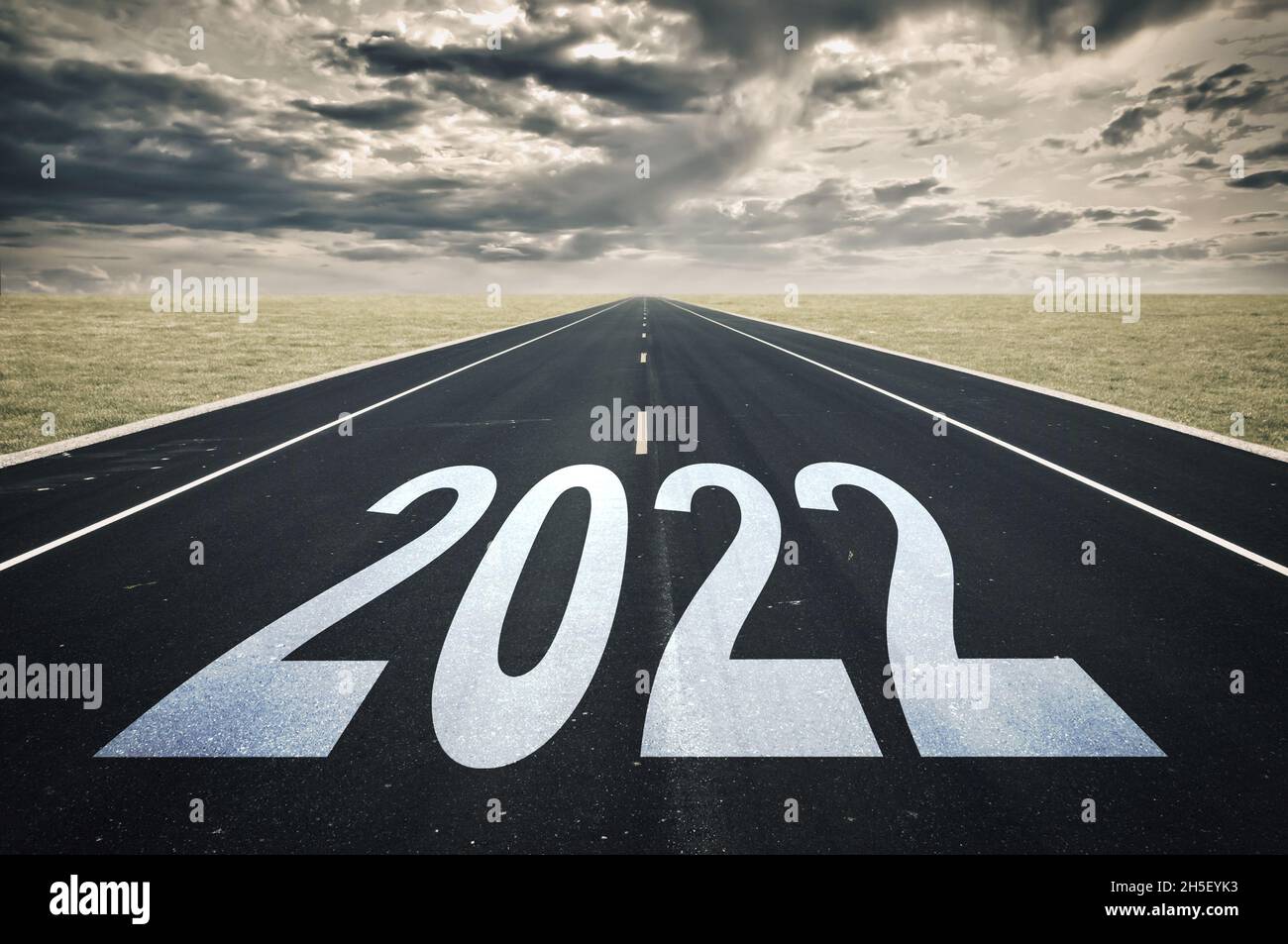 2022 road perspective, dark clouds, crisis concept Stock Photo
