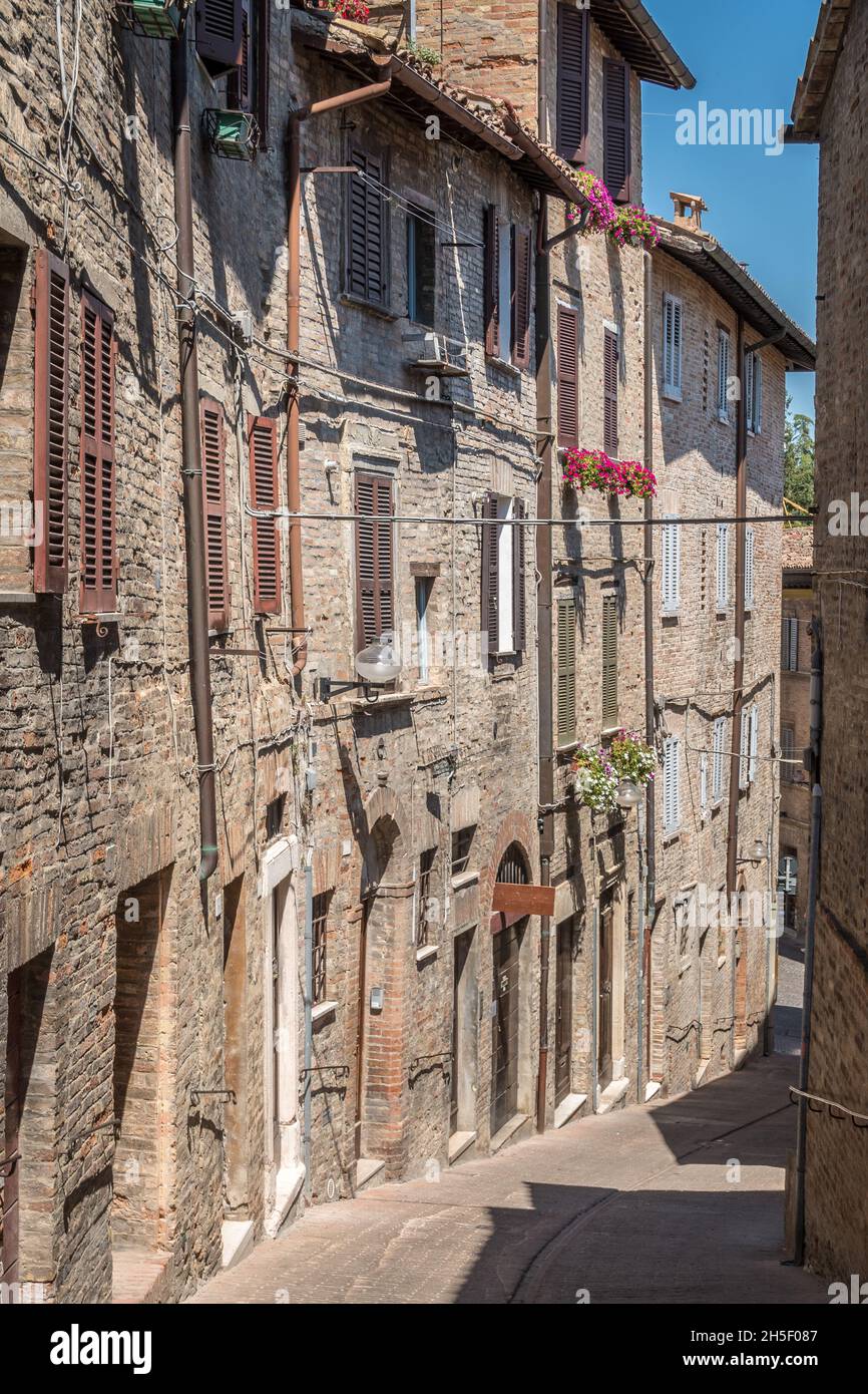 Medieval alley in italian city of Urbino, Marche, Italy, Europe Stock Photo