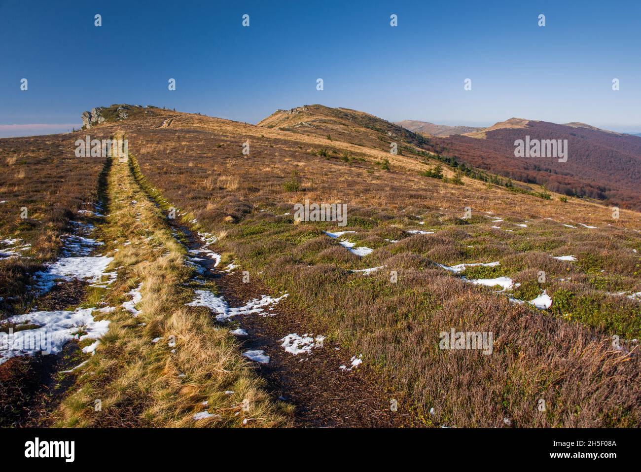 View of hills of vast Water Dividing ridge covered in red, orange ...