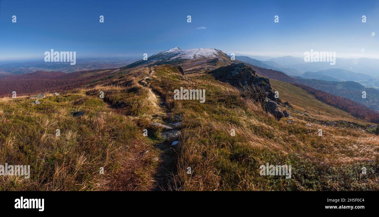 Panoramic view of hills of Water Dividing ridge covered in red, orange ...