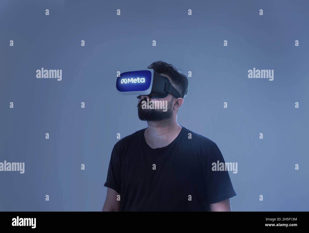 Guy Wearing Virtual Reality Goggles Inside A Metaverse Meta Written On The Google Stock Photo