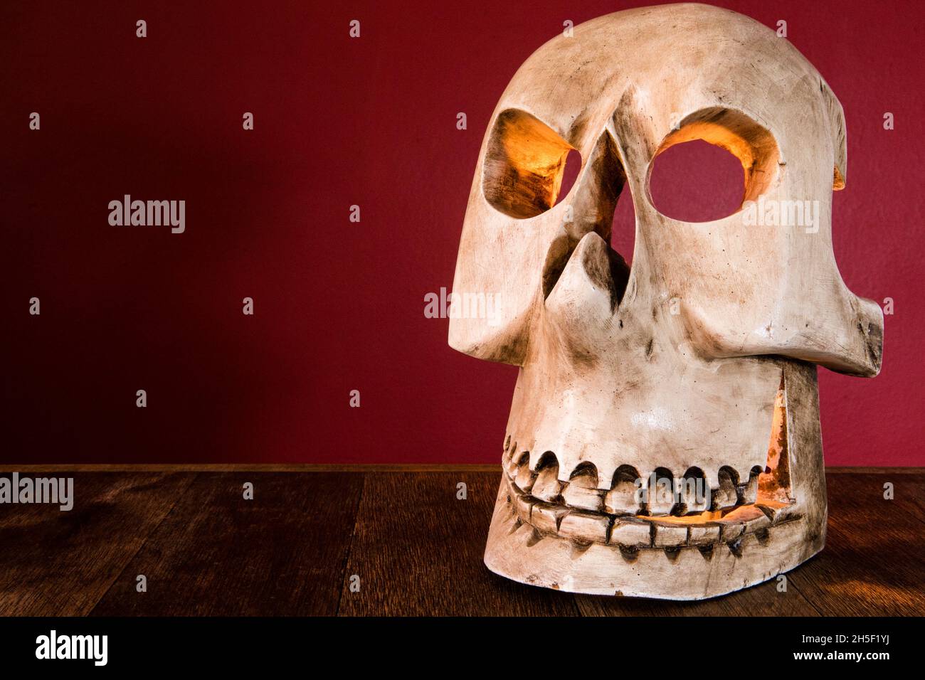 Closeup shot of a handcrafted skull mask on a table on a Day of the Dead Stock Photo