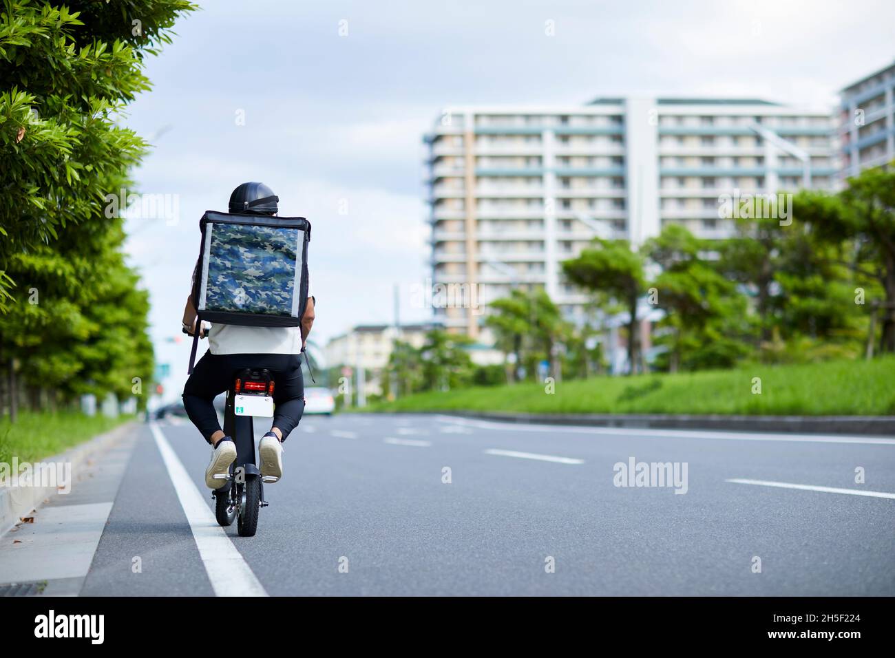 Electric scooter food delivery Stock Photo Alamy