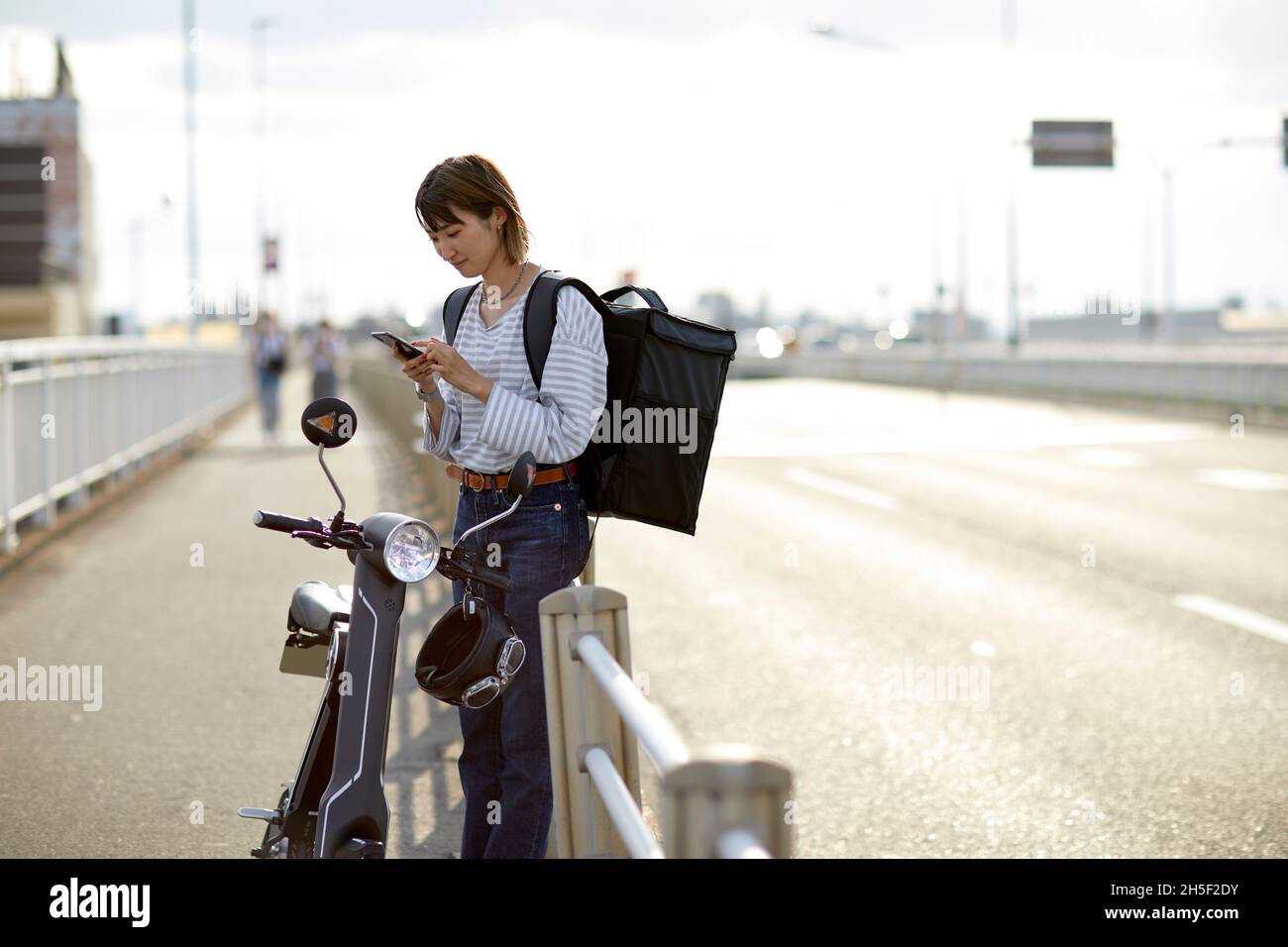 Electric scooter food delivery Stock Photo Alamy