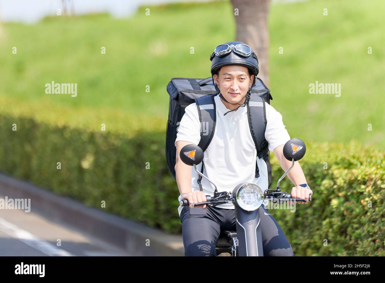 Electric scooter food delivery Stock Photo Alamy