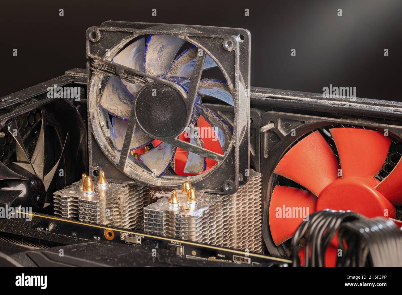stopped 90 mm pc fan close-up with thick layer of dust Stock Photo