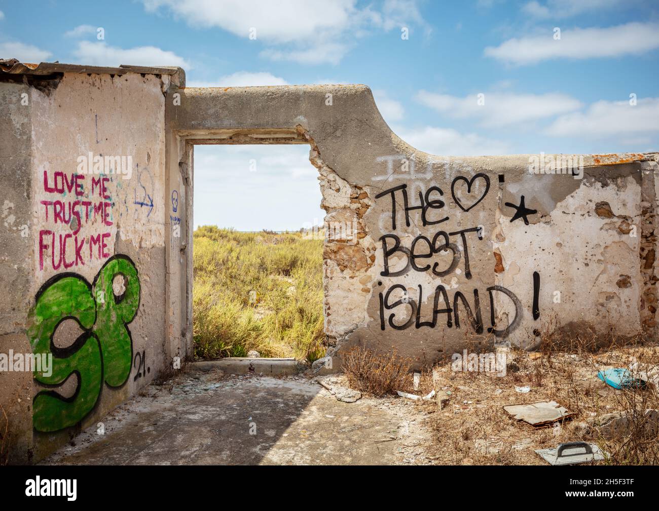 Culatra, Faro, Portugal - August 25 2021: The Best Island Graffiti on abandoned building walls. Culatra Island is a popular desitination for thousands Stock Photo