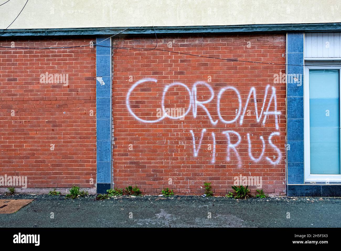 Corona Virus writing on the wall Stock Photo