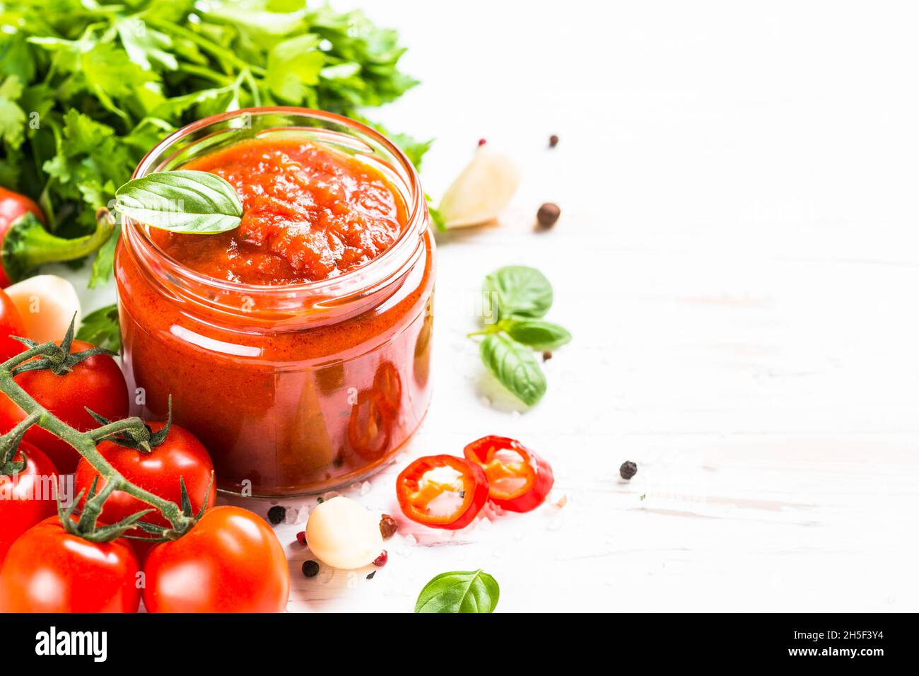 Tomato sauce with herbs and spices at white background Stock Photo Alamy