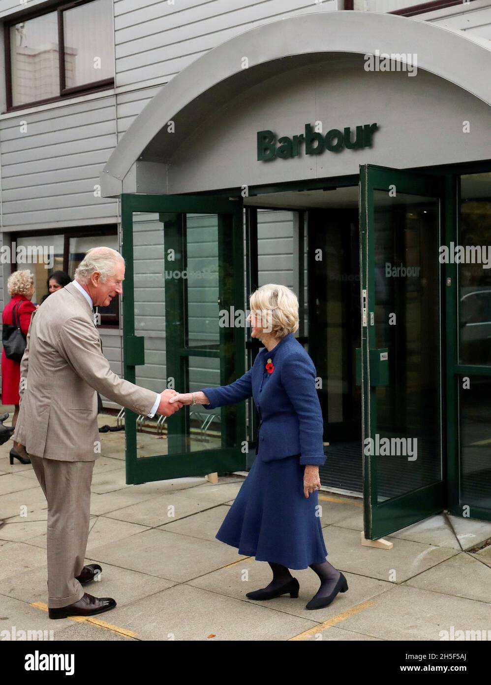 Britain's Prince Charles meets Margaret Barbour as he arrives for a visit  to Royal Warrant Holder, J Barbour And Sons Ltd, in South Shields, Britain  November 9, 2021. Scott Heppell/Pool via REUTERS