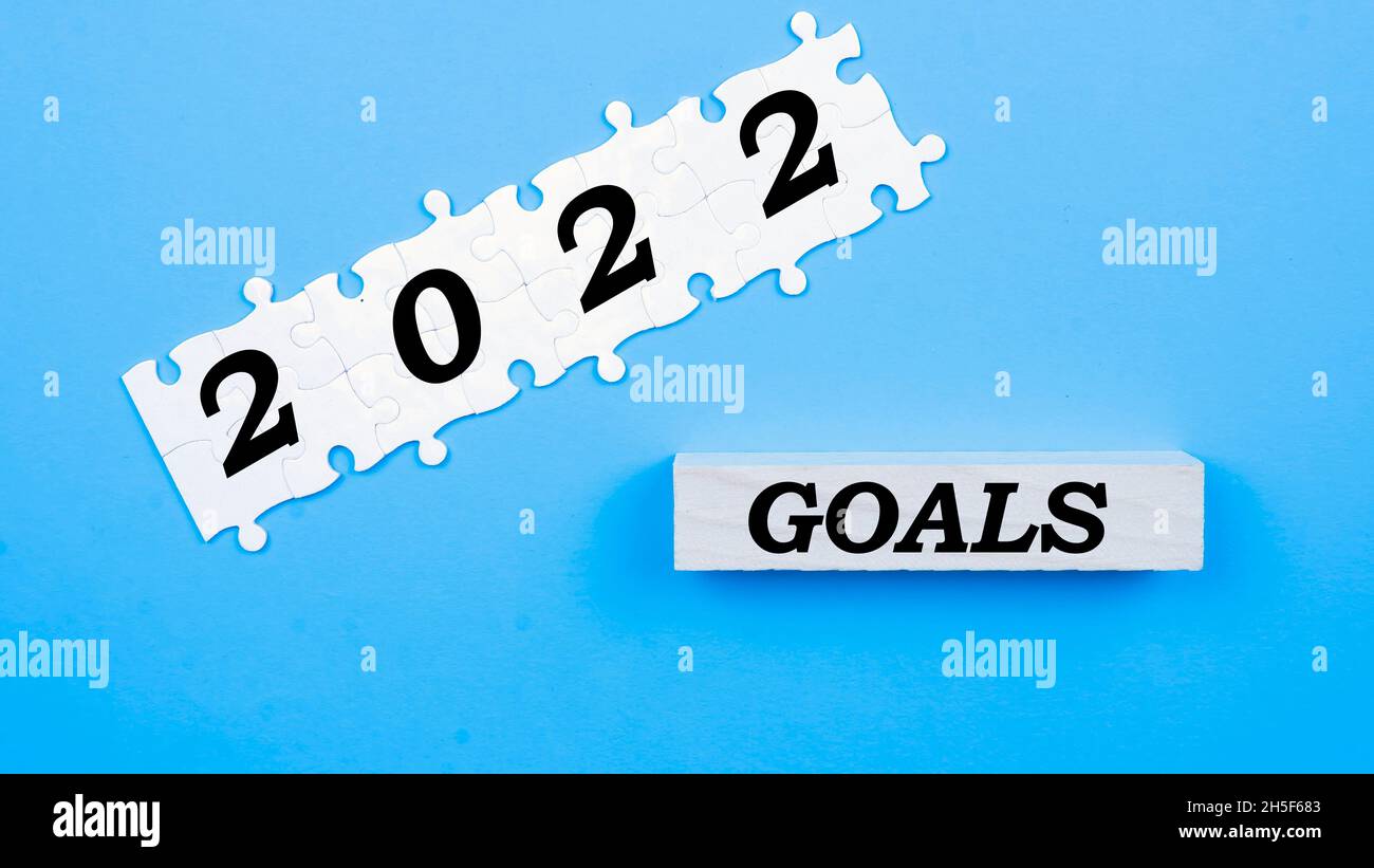 A selective focis of a word goal on a blue background. Goal is for achievment people do every year resolution. Stock Photo