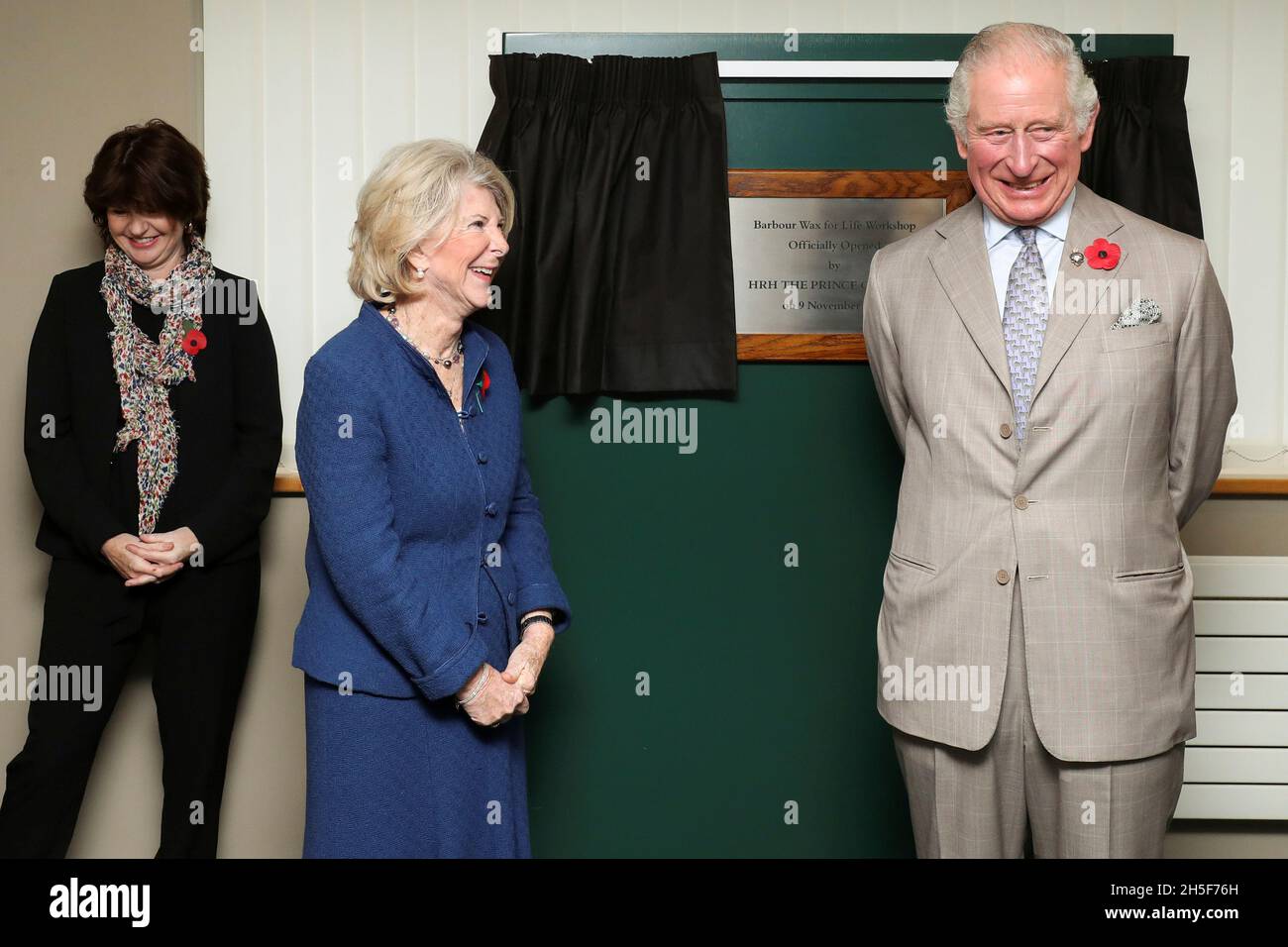 Britain's Prince Charles stands with Margaret Barbour after unveiling a  plaque during his visit to Royal Warrant Holder, J Barbour And Sons Ltd, in South  Shields, Britain November 9, 2021. Scott Heppell/Pool