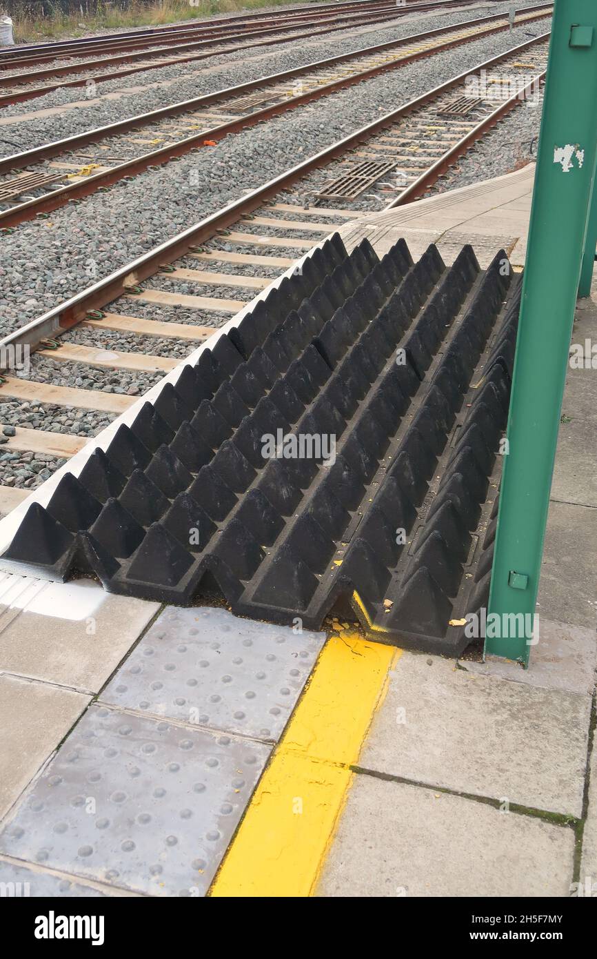 Anti-trespass panels at the end of the platform at Cardiff Central railway station. Stock Photo