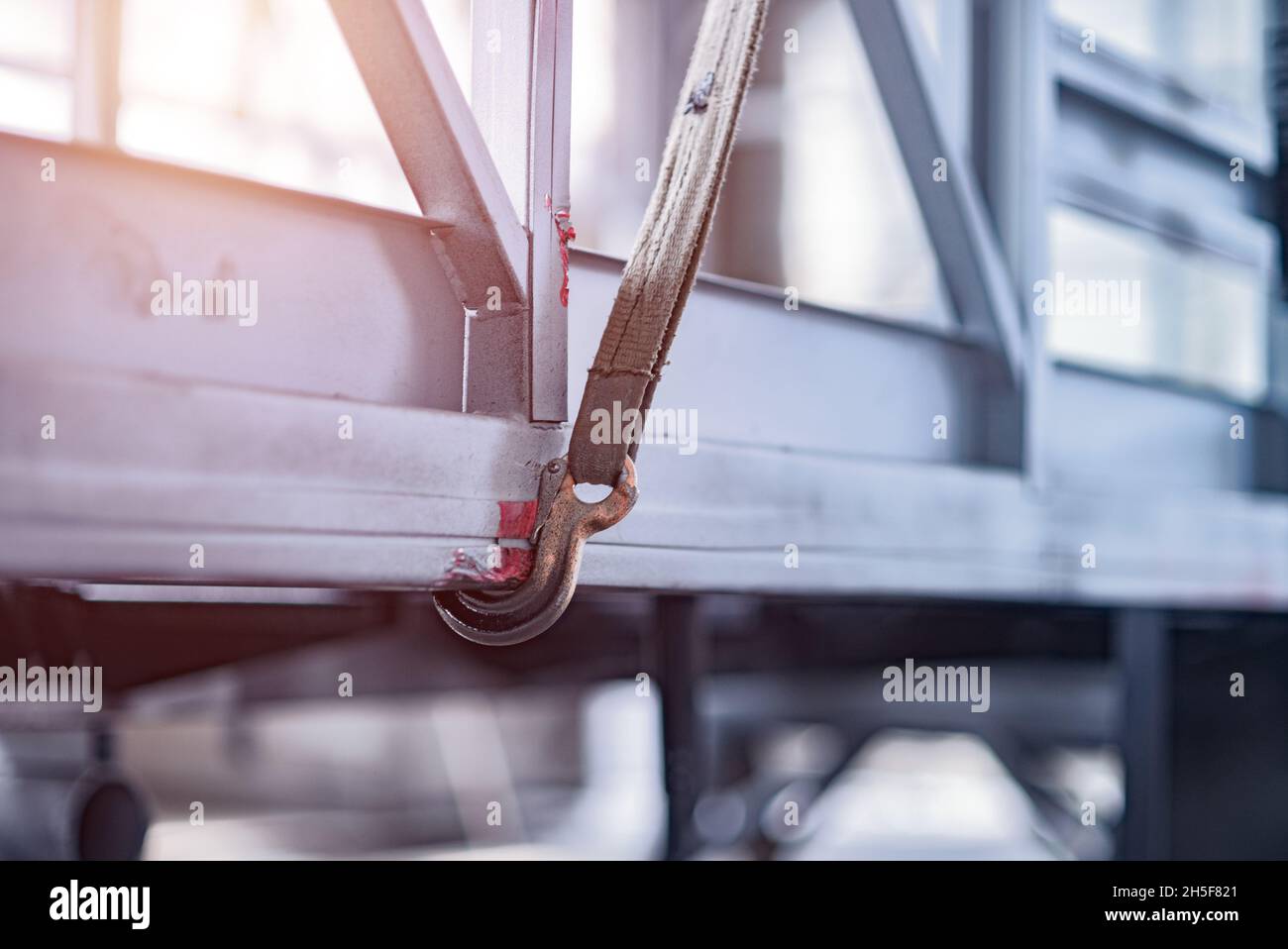 Iron hook secures metal structure. Stock Photo