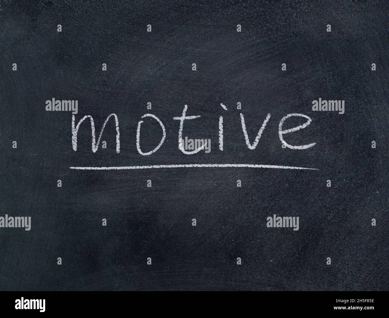 motive concept word on blackboard background Stock Photo