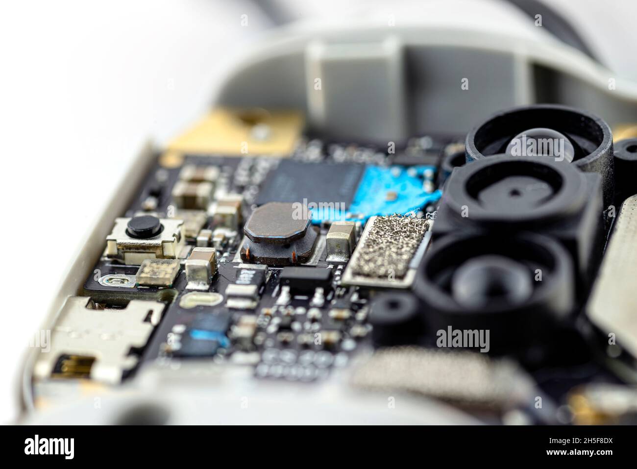 Macro pictures of an integrated circuit on a black PCB, visible optical