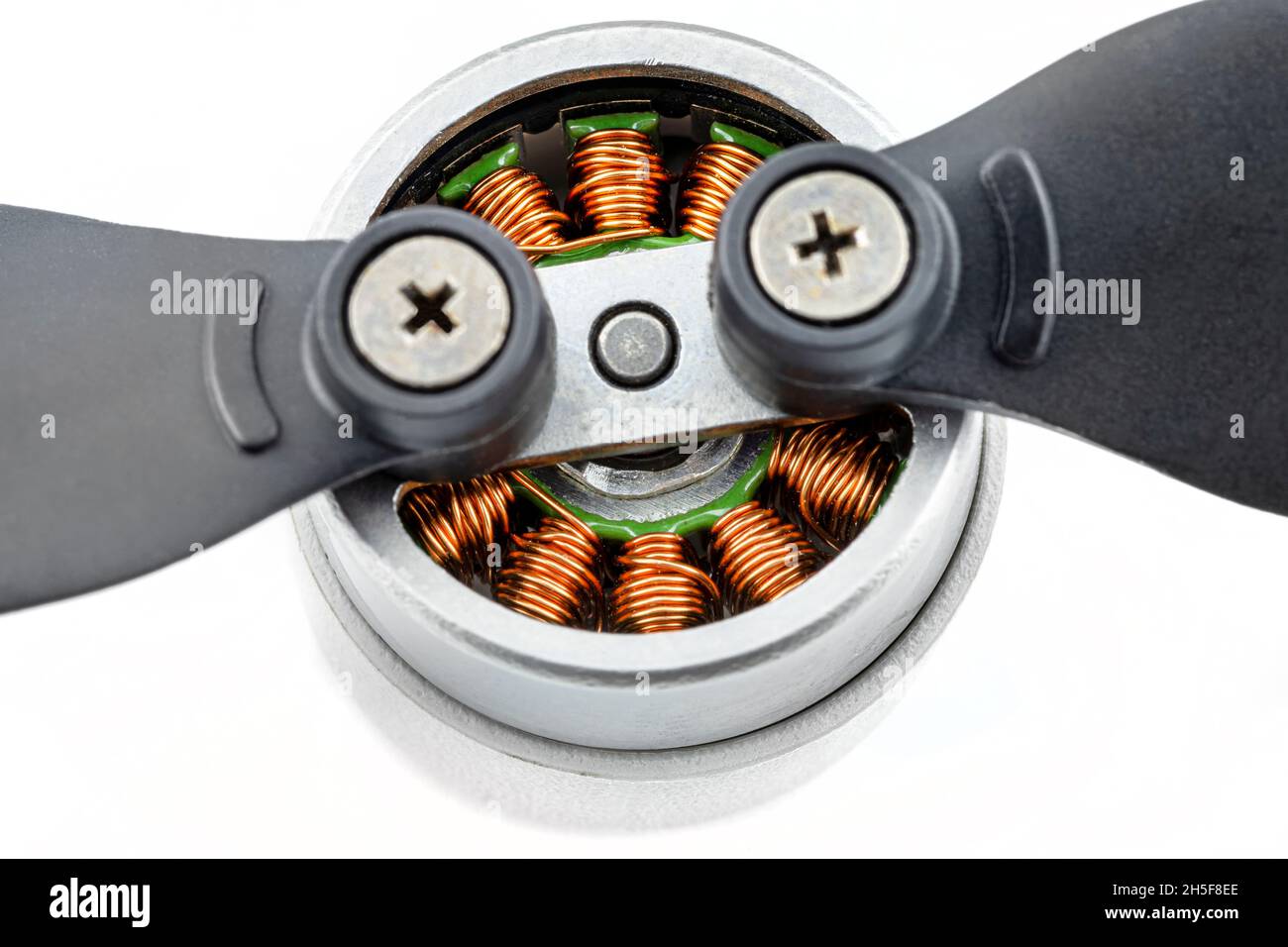 Macro photo of a drones brushless motor connected to plastic propellers