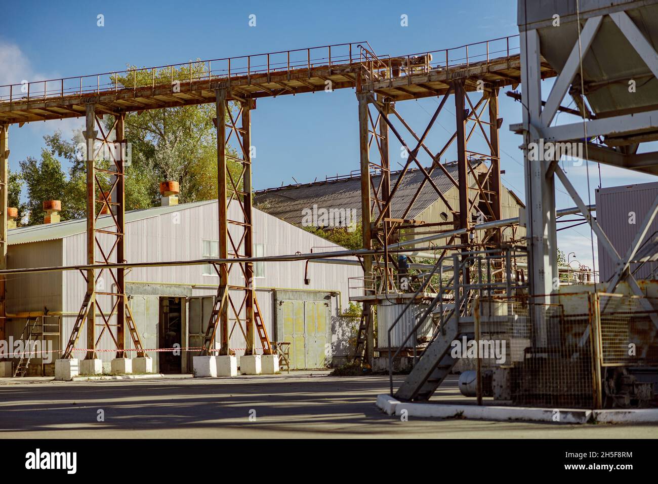 Manufacturing plant with warehouse and staircase crane system Stock