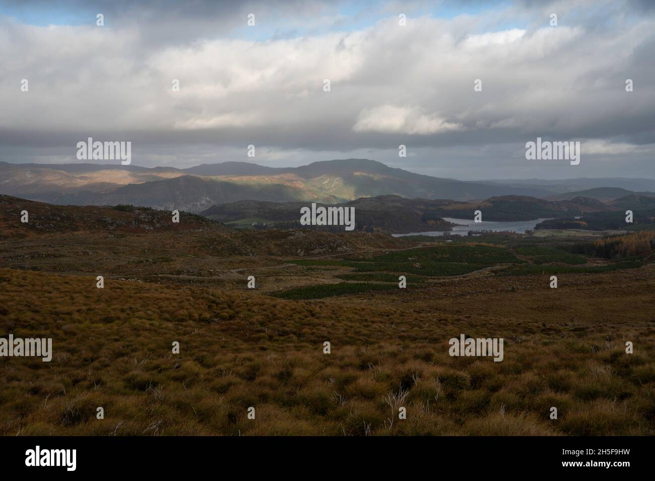 Taken from famous Suidhe viewpoint looking over moorland, lakes and mountains with blue sky and clouds. Scottish Highlands, near Fort Augustus. Stock Photo
