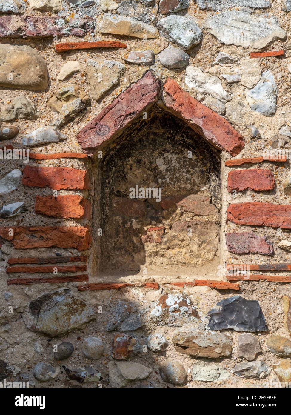 A niche in a brick and stone wall Stock Photo
