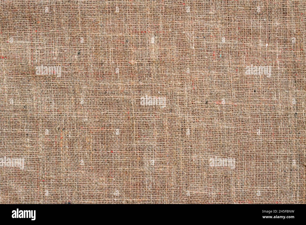Beige sackcloth background, natural cloth backdrop, copy space Stock Photo