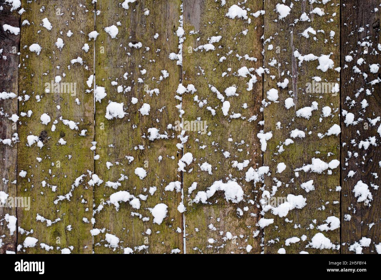 Old wooden fence background covered with snow Stock Photo - Alamy