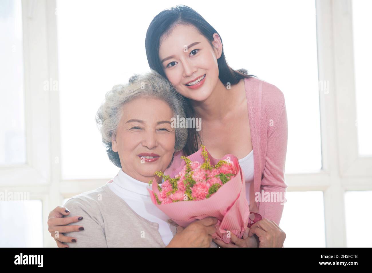 Happy mother and daughter and gifts Stock Photo