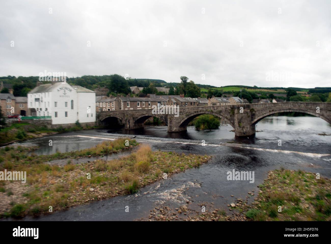 River South Tyne and Old Haydon Bridge next to White painted Anchor