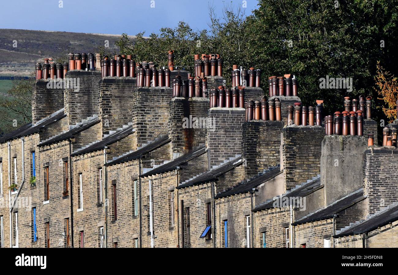 Chimney pots onTerraced houses housing in Hebden Bridge in the Upper Calder Valley in West Yorkshire, England, Uk. aerial view Stock Photo