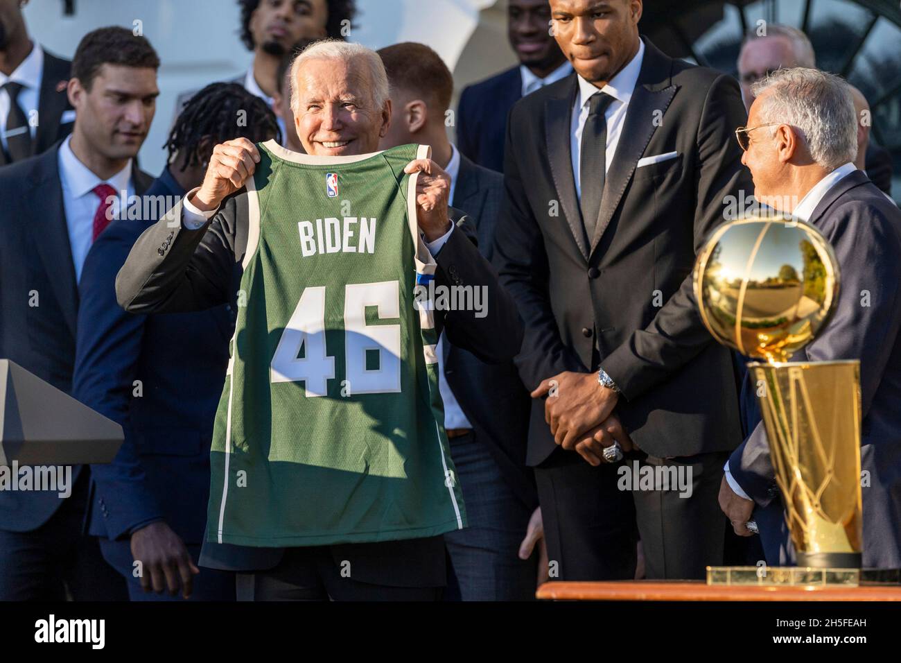 Washington, United States Of America. 08th Nov, 2021. Washington, United States of America. 08 November, 2021. U.S President Joe Biden is presented a team jersey during a gathering to celebrate the 2021 NBA Champion Milwaukee Bucks basketball team on the South Lawn of the White House November 8, 2021 in Washington, DC Credit: Adam Schultz/White House Photo/Alamy Live News Stock Photo