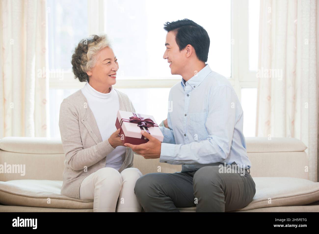 Happy mother and son and presents Stock Photo