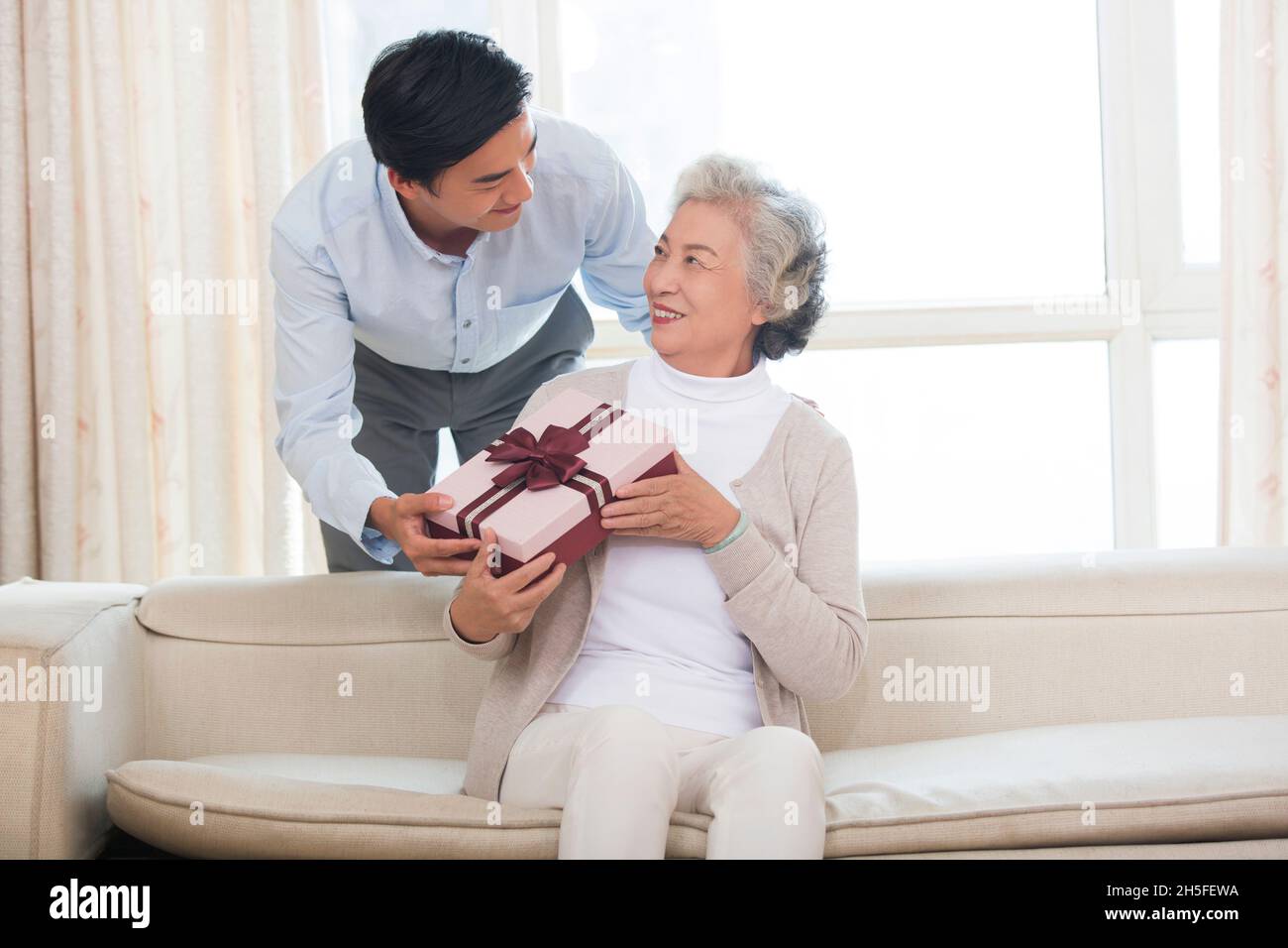Happy mother and son and presents Stock Photo