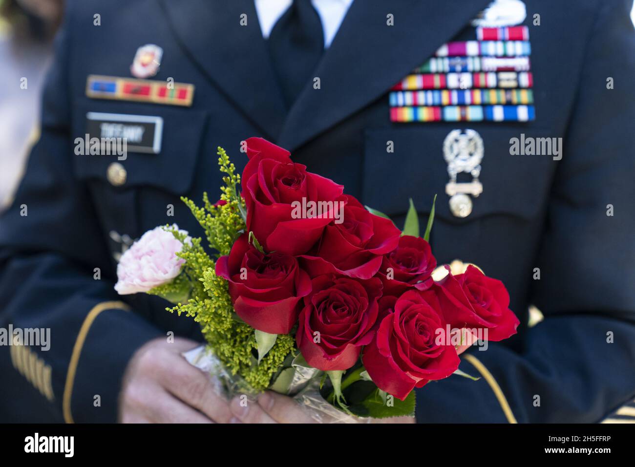 Arlington, United States. 09th Nov, 2021. A U.S. Army soldier holds flowers to be placed during a centennial commemoration event at the Tomb of the Unknown Soldier, in Arlington National Cemetery in Arlington, Virginia on November 9, 2021. Pool Photo by Alex Brandon/UPI Credit: UPI/Alamy Live News Stock Photo