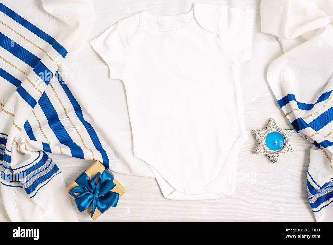 Jewish holiday Hanukkah baby bodysuit mock up with menorah and decor Stock Photo